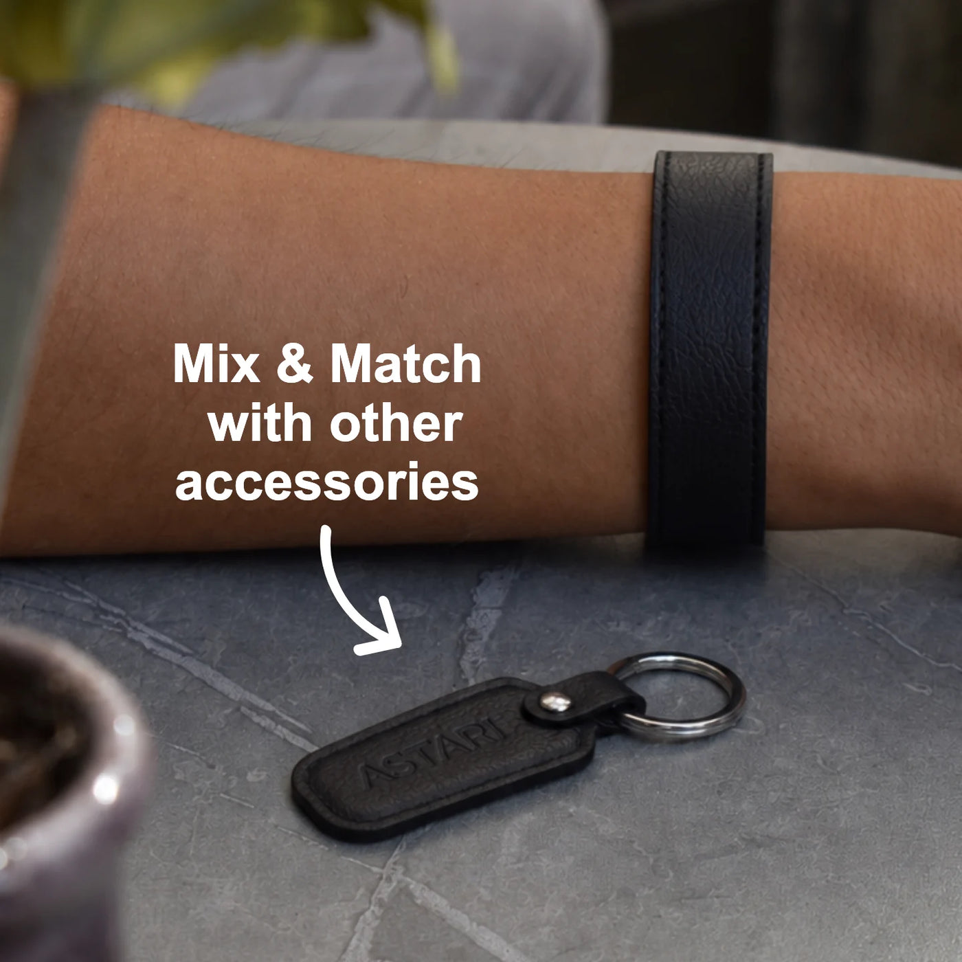 Black Falcon payment bracelet styled with an Astari keychain