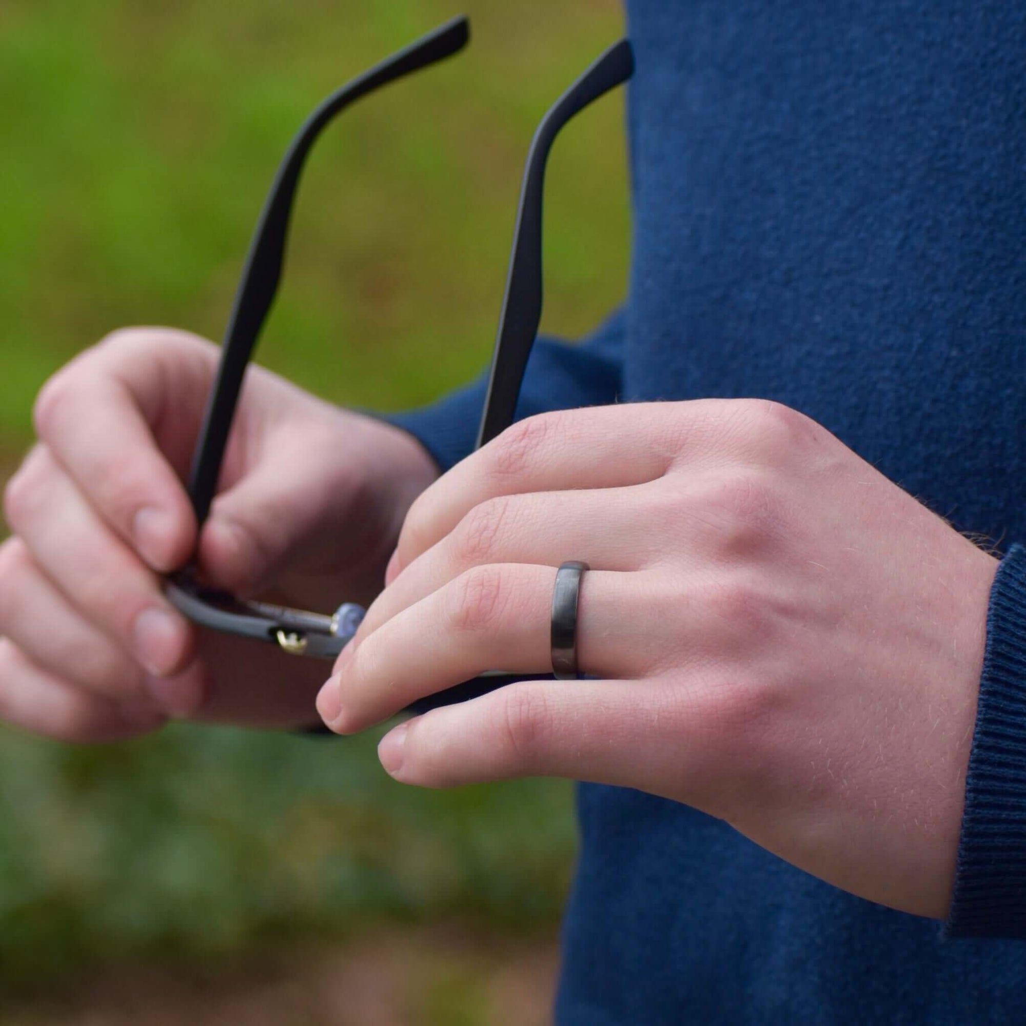 Model wearing Astari Atlantis ceramic black contactless payment ring, luxurious design, waterproof