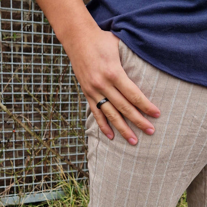 Person wearing Astari Atlantis sustainable ceramic payment ring, a passive and waterproof payment wearable.